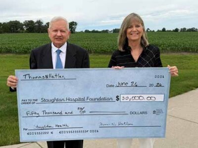 Photo of Thomas N. Hatlen and Lori Allen, Stoughton Hospital Foundation Board Director, recognizing Hatlen's $50,000 donation to the Stoughton Hospital Foundation
